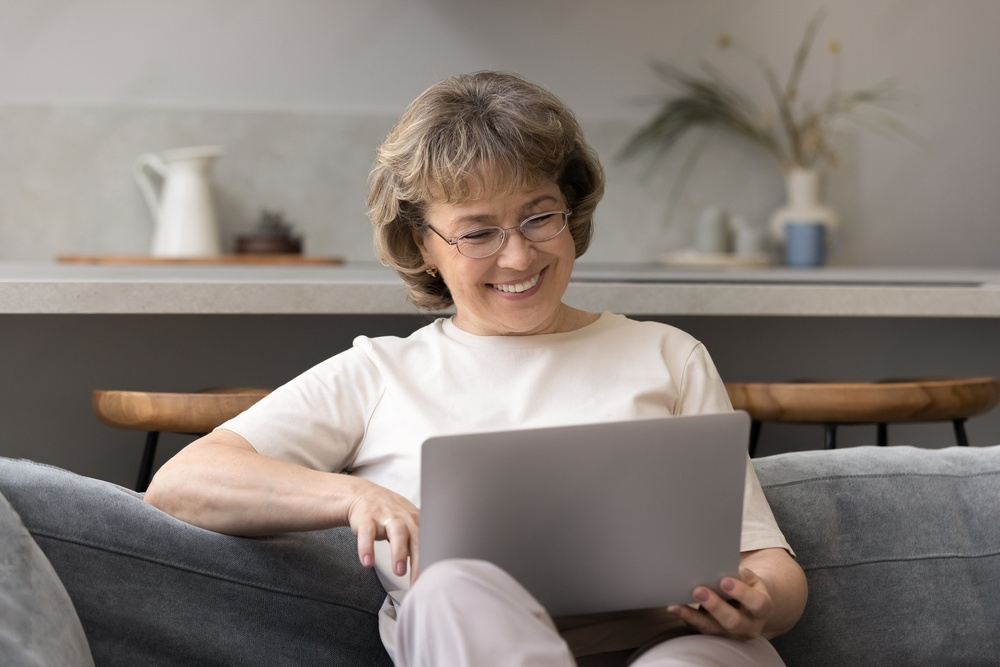 mature 60s woman consulting doctor online